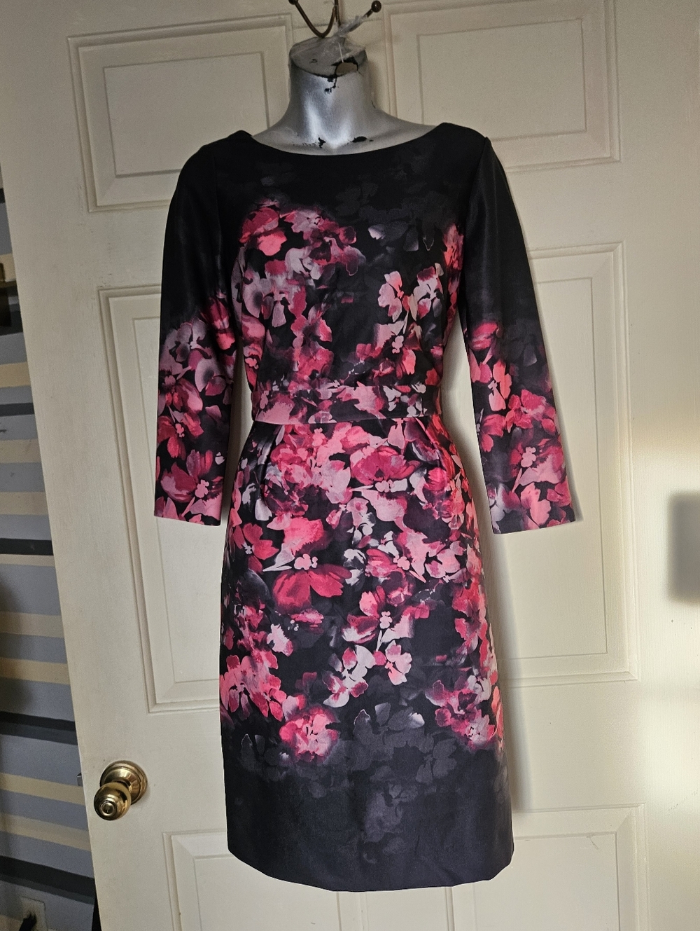 Antonio Melani floral print dress, featuring a black base with pink flowers,